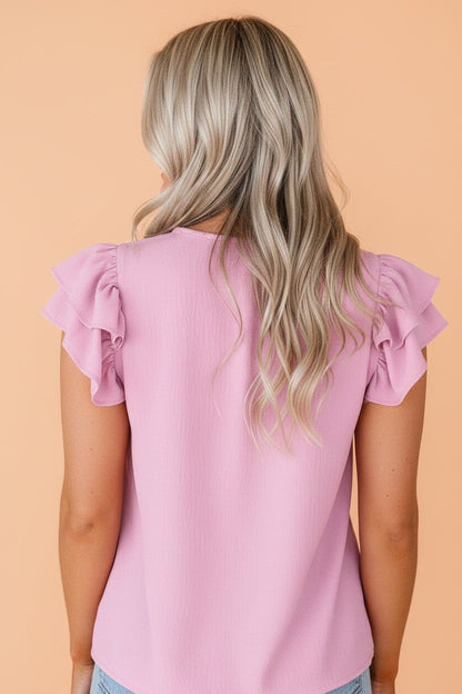 Enfärgad, texturerad topp med V-ringning och volangärmar